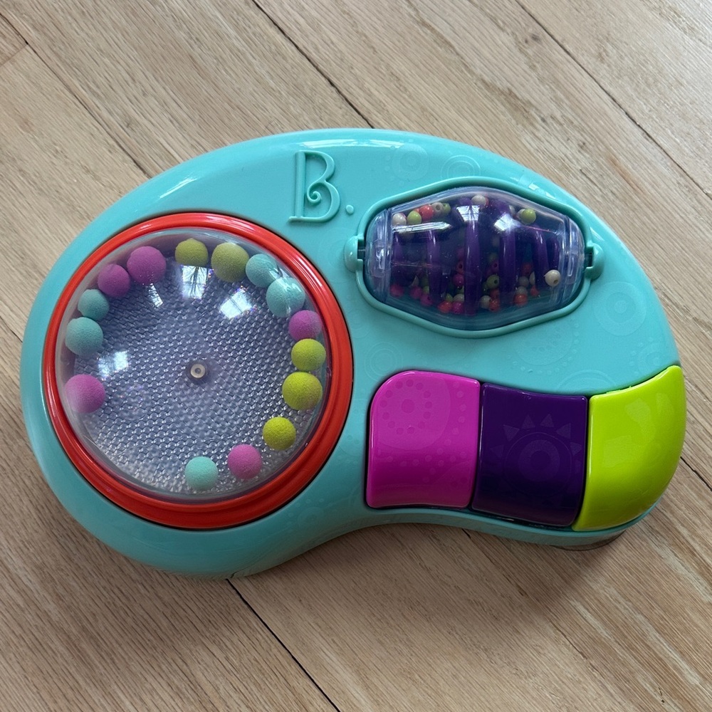B Toys baby activity station. Highchair suction cup toy with music and lights.